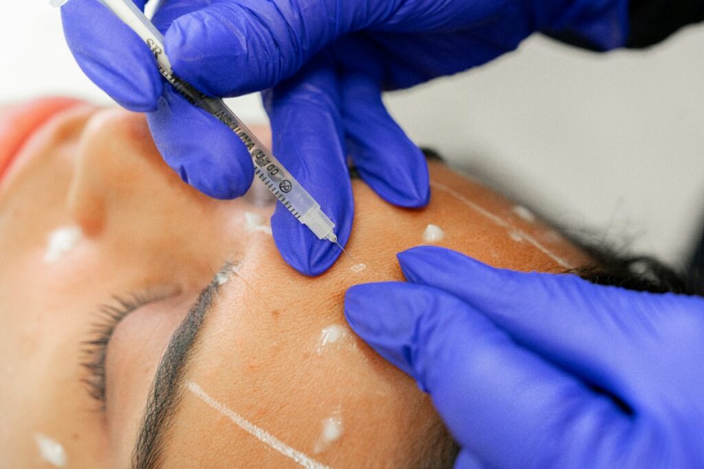 Doctor administering anti-wrinkle injections at Kora Lawler Aesthetics